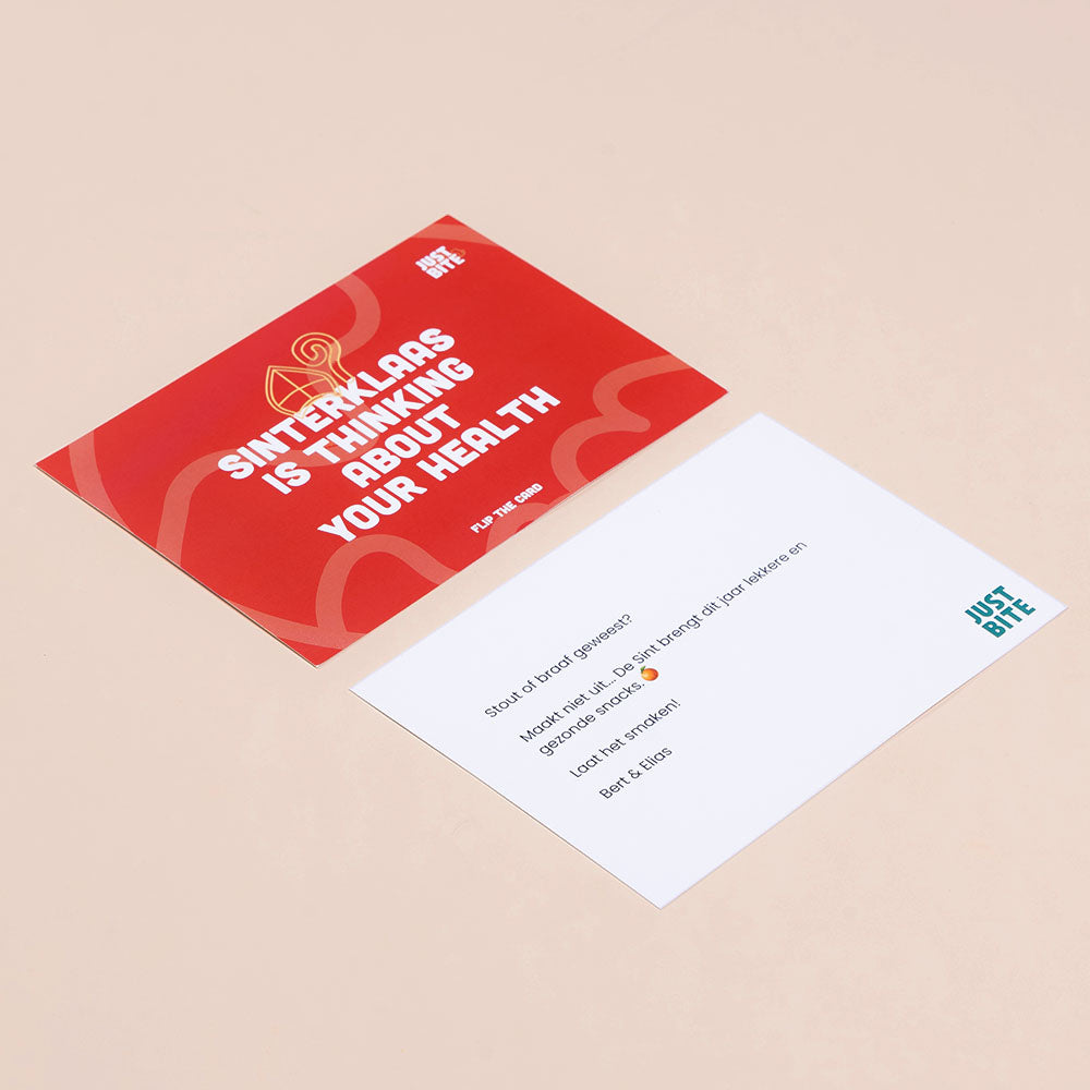Voor- en achterkant van een gepersonaliseerd Sinterklaas-kaartje van JustBite met de tekst 'Sinterklaas is thinking about your health' en een persoonlijke boodschap